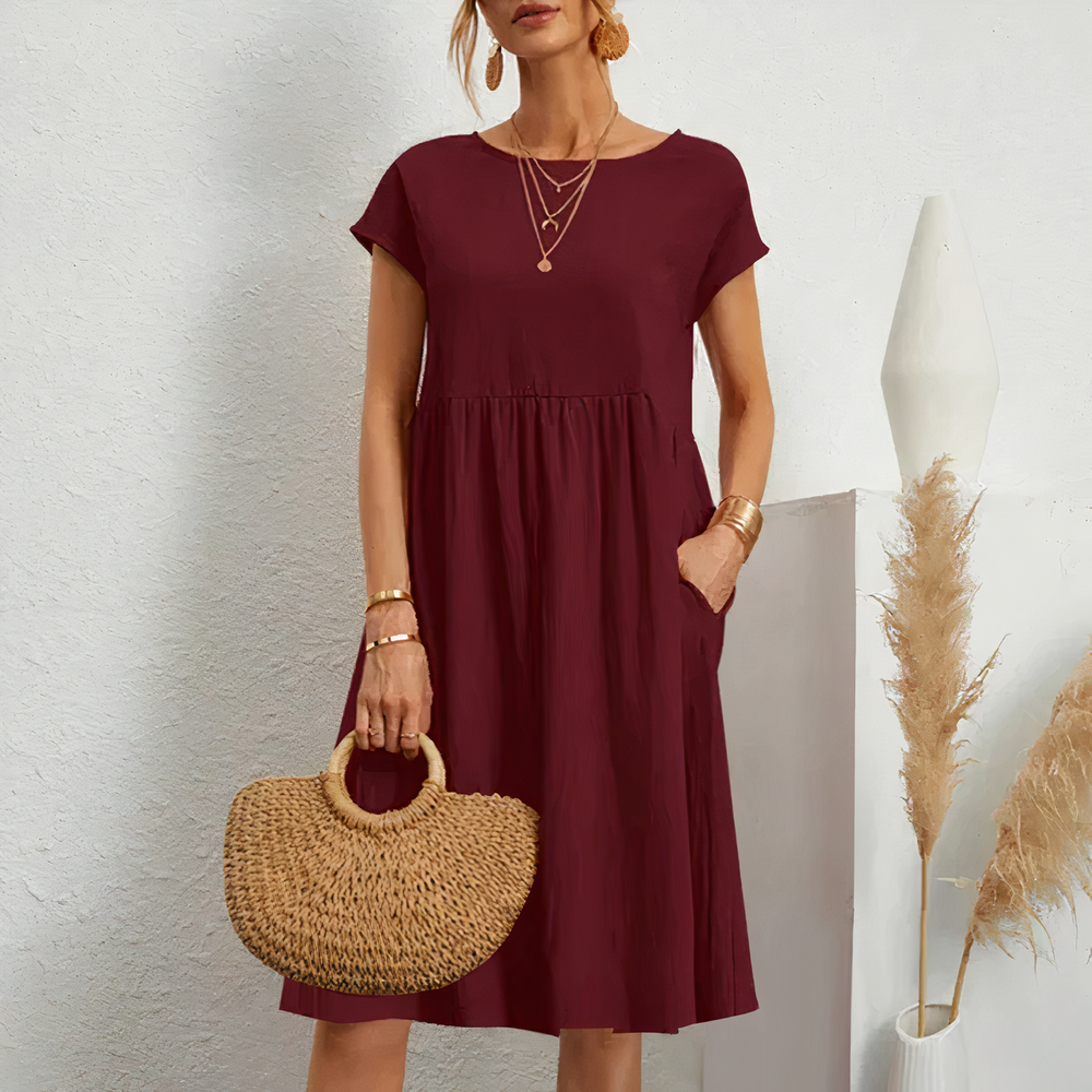 Lina stijlvolle knielange zomerjurk met een licht en ademend ontwerp voor ultiem comfort op warme dagen. Gemaakt van zacht polyester en geschikt voor diverse gelegenheden zoals werk, vakanties en feesten. De perfecte mix van casual en elegantie met een flatterende pasvorm. Verkrijgbaar in wit, khaki, perzik, rode claret, paars, grijs, zwart, donkerblauw, blauw en legergroen, maten XS-2XL. Upgrade je zomergarderobe met Lina en straal moeiteloze stijl uit. Bestel nu!