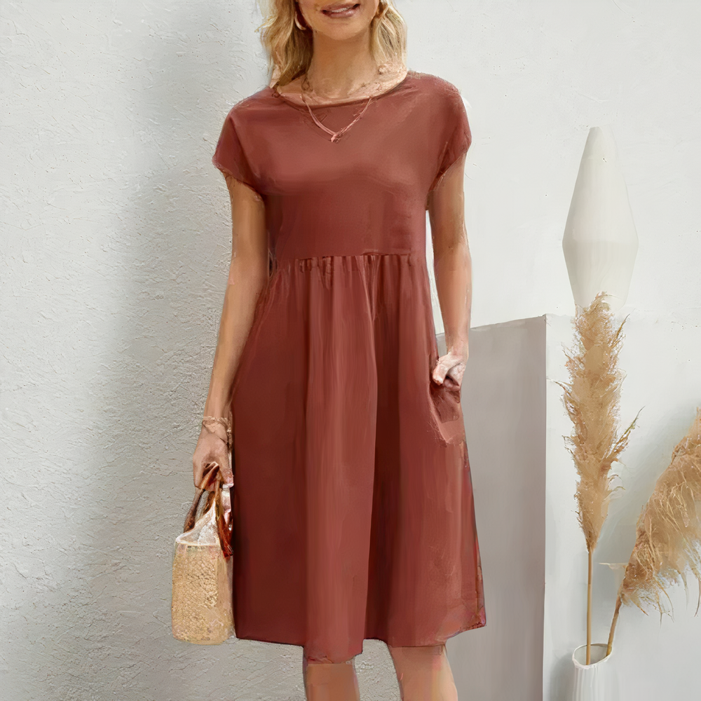 Lina stijlvolle knielange zomerjurk met een licht en ademend ontwerp voor ultiem comfort op warme dagen. Gemaakt van zacht polyester en geschikt voor diverse gelegenheden zoals werk, vakanties en feesten. De perfecte mix van casual en elegantie met een flatterende pasvorm. Verkrijgbaar in wit, khaki, perzik, rode claret, paars, grijs, zwart, donkerblauw, blauw en legergroen, maten XS-2XL. Upgrade je zomergarderobe met Lina en straal moeiteloze stijl uit. Bestel nu!