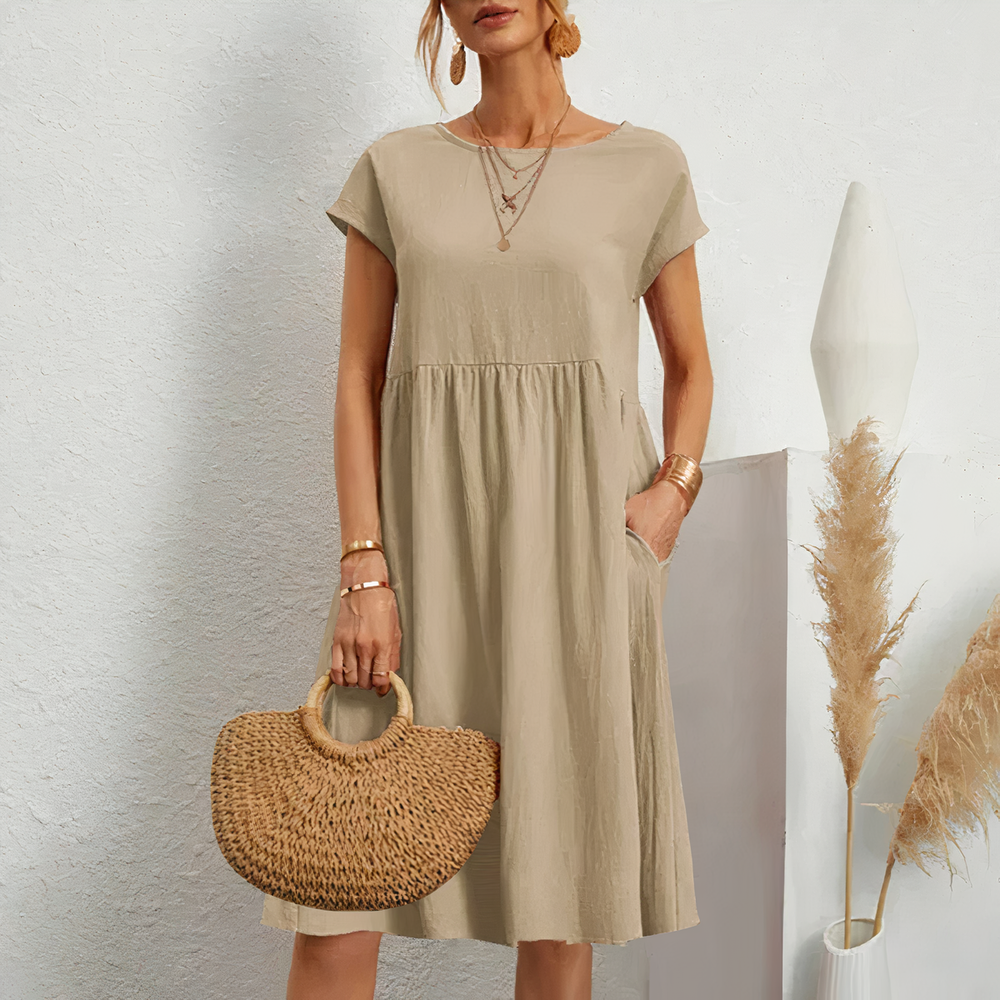 Lina stijlvolle knielange zomerjurk met een licht en ademend ontwerp voor ultiem comfort op warme dagen. Gemaakt van zacht polyester en geschikt voor diverse gelegenheden zoals werk, vakanties en feesten. De perfecte mix van casual en elegantie met een flatterende pasvorm. Verkrijgbaar in wit, khaki, perzik, rode claret, paars, grijs, zwart, donkerblauw, blauw en legergroen, maten XS-2XL. Upgrade je zomergarderobe met Lina en straal moeiteloze stijl uit. Bestel nu!