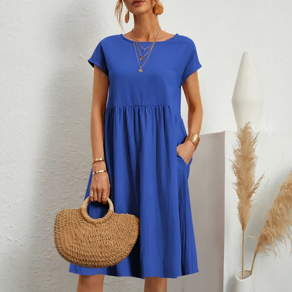 Lina stijlvolle knielange zomerjurk met een licht en ademend ontwerp voor ultiem comfort op warme dagen. Gemaakt van zacht polyester en geschikt voor diverse gelegenheden zoals werk, vakanties en feesten. De perfecte mix van casual en elegantie met een flatterende pasvorm. Verkrijgbaar in wit, khaki, perzik, rode claret, paars, grijs, zwart, donkerblauw, blauw en legergroen, maten XS-2XL. Upgrade je zomergarderobe met Lina en straal moeiteloze stijl uit. Bestel nu!