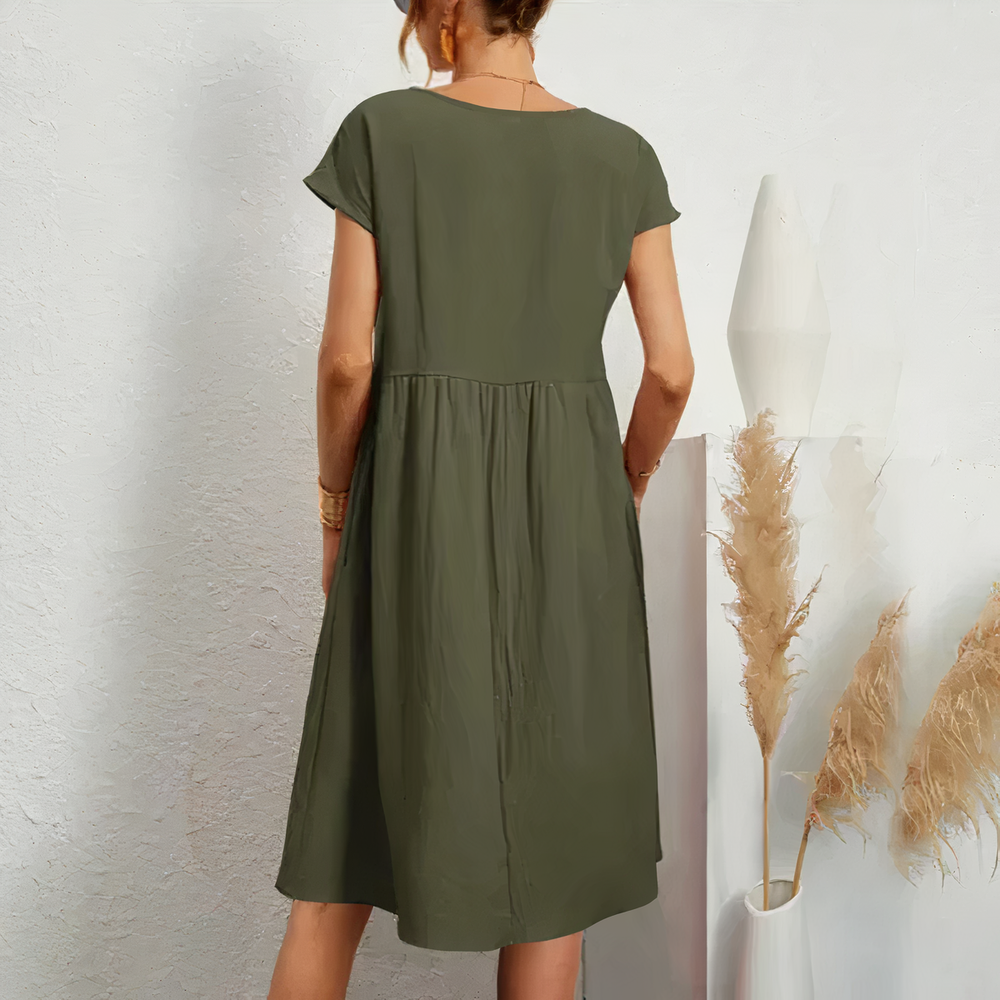 Lina stijlvolle knielange zomerjurk met een licht en ademend ontwerp voor ultiem comfort op warme dagen. Gemaakt van zacht polyester en geschikt voor diverse gelegenheden zoals werk, vakanties en feesten. De perfecte mix van casual en elegantie met een flatterende pasvorm. Verkrijgbaar in wit, khaki, perzik, rode claret, paars, grijs, zwart, donkerblauw, blauw en legergroen, maten XS-2XL. Upgrade je zomergarderobe met Lina en straal moeiteloze stijl uit. Bestel nu!