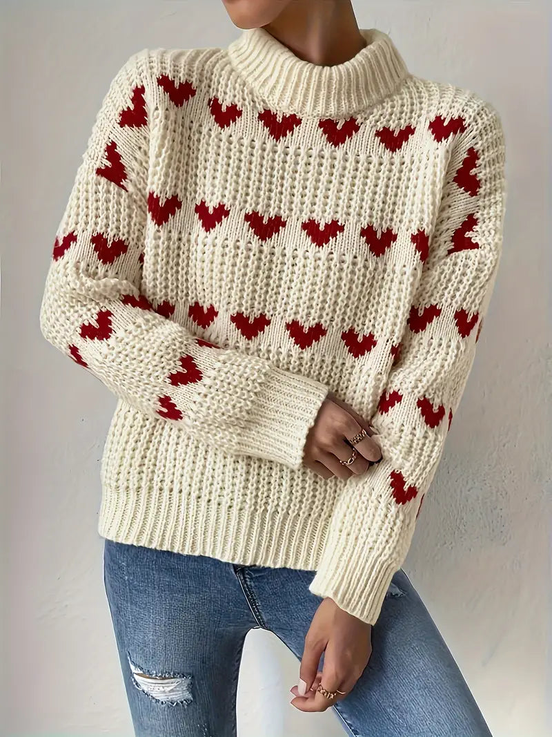 Naomi trui met hartpatroon – een warme en speelse essential voor de gezellige seizoenen. Met een textured breisel, knusse turtleneck en relaxte pasvorm biedt deze trui comfort en stijl. Perfect voor casual dagen, gezellige avonden of als speelse toevoeging aan je garderobe. Combineer moeiteloos met jeans, leggings of rokken. Verkrijgbaar in beige, maten S-L. Voeg charme en warmte toe aan je outfit met de Naomi. Bestel nu!
