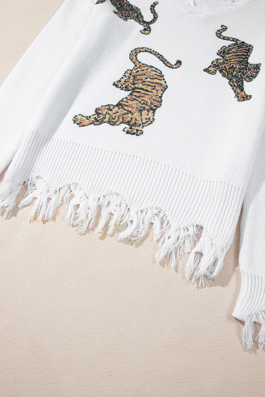 Monroe | Witte trui met rafelige details en pailletten