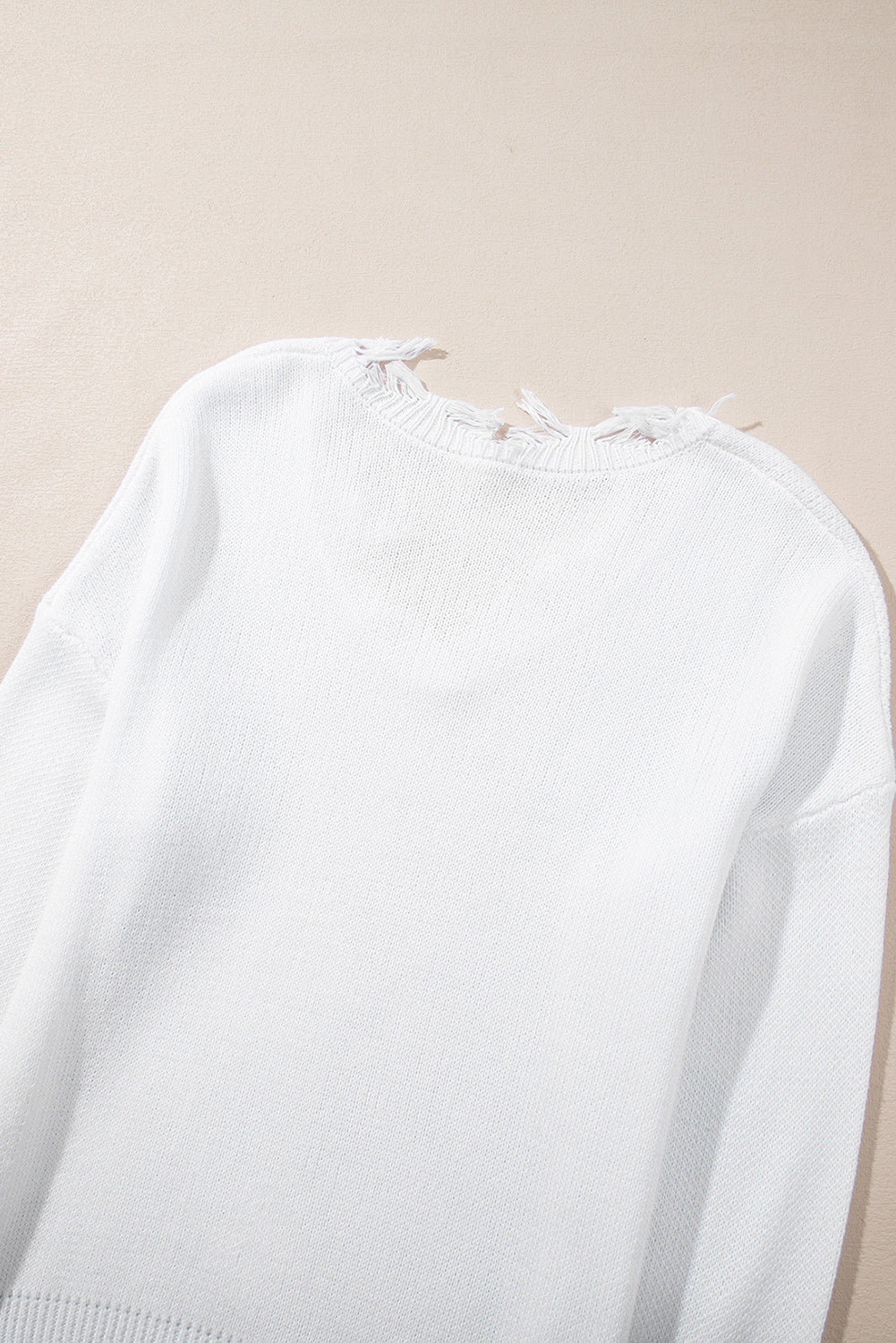 Monroe | Witte trui met rafelige details en pailletten