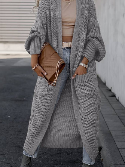 Vivienne | Voeg moeiteloze stijl en warmte toe aan je garderobe met de Vivienne. Deze oversized jas heeft een tijdloos silhouet, grote functionele zakken en is gemaakt van zachte, knusse stof. Verkrijgbaar in marineblauw, donkergrijs, kameel, lichtgrijs en zwart, en maten S-4XL. Perfect voor frisse dagen en stijlvolle casual looks. Combineer comfort en veelzijdigheid met de Vivienne. Bestel nu en geniet van tijdloze elegantie en ultiem draagcomfort!