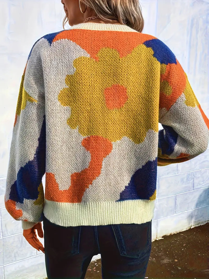 Arabella trui met abstract bloemenontwerp – een levendig en artistiek statementstuk voor je garderobe. Met een comfortabele pasvorm en lichte warmte biedt deze trui een perfecte mix van stijl en comfort. Ideaal voor casual dagen, creatieve bijeenkomsten of gezellige avonden. Combineer eenvoudig met jeans of leggings voor een opvallende look. Verkrijgbaar in veelkleurig, maten S-XL. Voeg expressieve flair en comfort toe aan je outfits met de Arabella. Bestel nu!