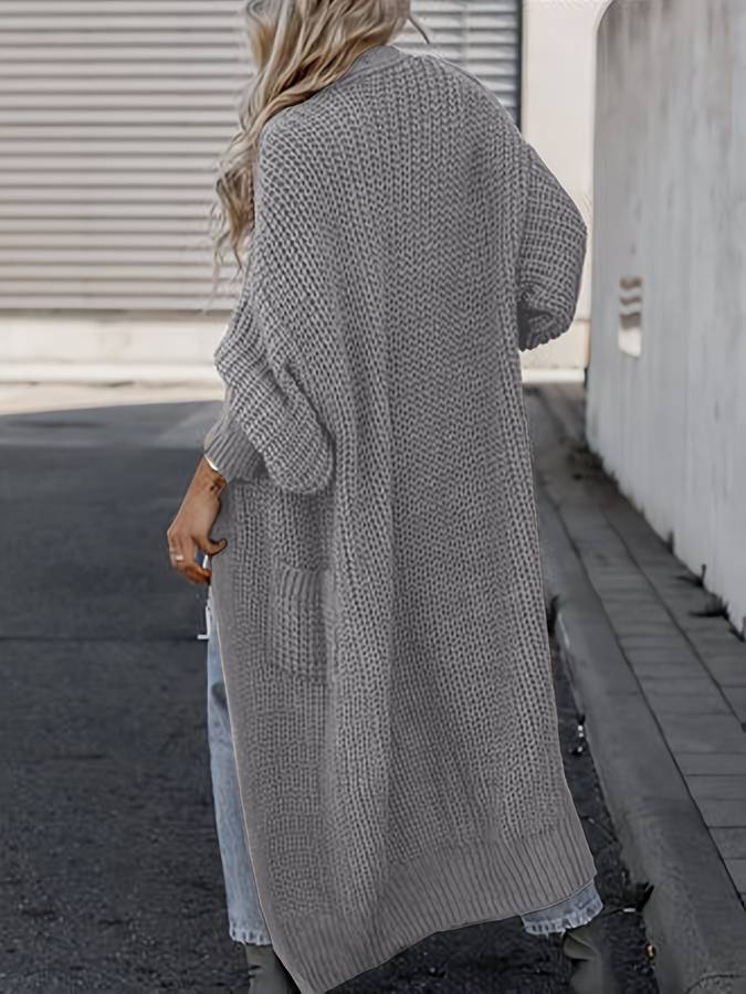 Vivienne | Voeg moeiteloze stijl en warmte toe aan je garderobe met de Vivienne. Deze oversized jas heeft een tijdloos silhouet, grote functionele zakken en is gemaakt van zachte, knusse stof. Verkrijgbaar in marineblauw, donkergrijs, kameel, lichtgrijs en zwart, en maten S-4XL. Perfect voor frisse dagen en stijlvolle casual looks. Combineer comfort en veelzijdigheid met de Vivienne. Bestel nu en geniet van tijdloze elegantie en ultiem draagcomfort!