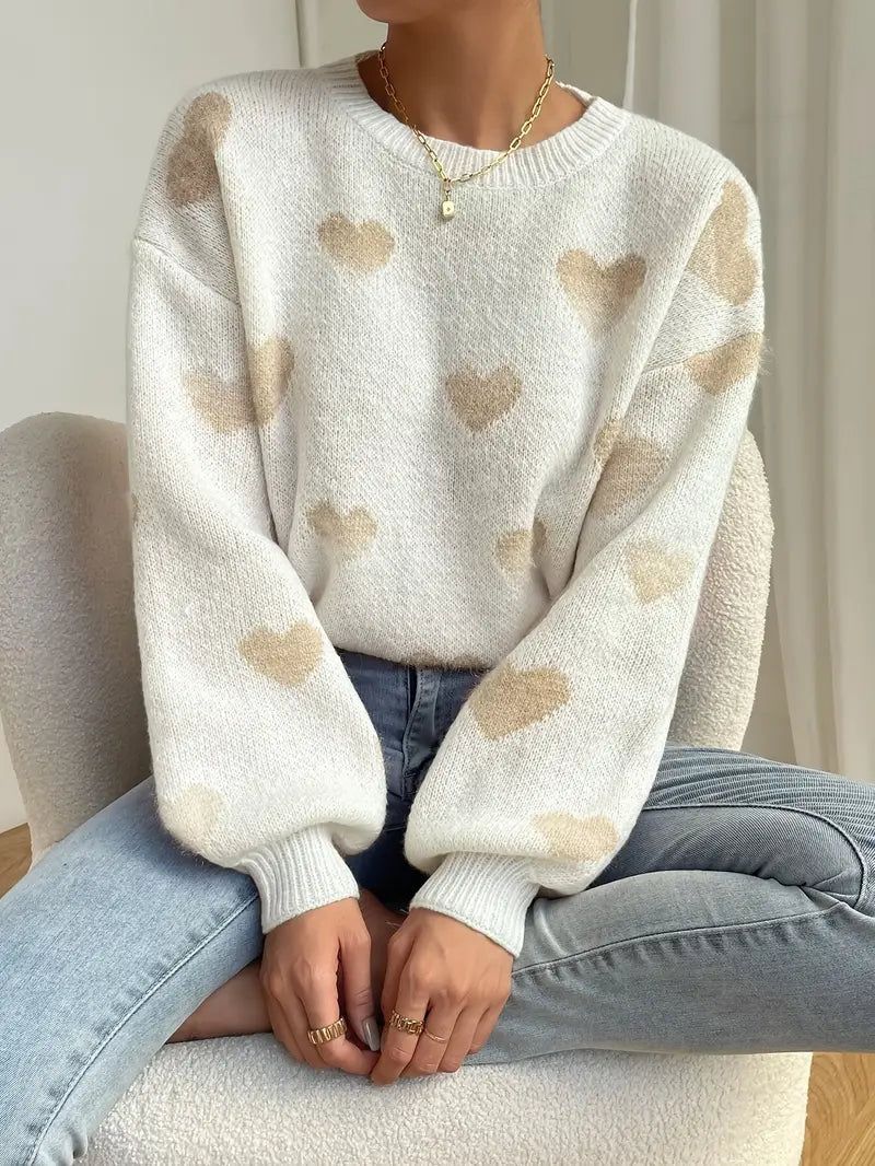Zariah trui: charmante witte trui met zacht hartpatroon voor een speelse en knusse uitstraling. Perfect voor casual uitjes, knusse weekenden of ontspannen dagen thuis. Ontspannen pasvorm en zachte stof bieden comfort en warmte bij koelere temperaturen. Combineer moeiteloos met jeans, leggings of rokken voor veelzijdige looks. Verkrijgbaar in maten XS-L. Voeg een vleugje vrolijke charme toe aan je garderobe met de Zariah. Bestel nu en ervaar comfort en stijl in één!
