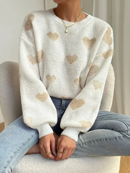 Zariah trui: charmante witte trui met zacht hartpatroon voor een speelse en knusse uitstraling. Perfect voor casual uitjes, knusse weekenden of ontspannen dagen thuis. Ontspannen pasvorm en zachte stof bieden comfort en warmte bij koelere temperaturen. Combineer moeiteloos met jeans, leggings of rokken voor veelzijdige looks. Verkrijgbaar in maten XS-L. Voeg een vleugje vrolijke charme toe aan je garderobe met de Zariah. Bestel nu en ervaar comfort en stijl in één!