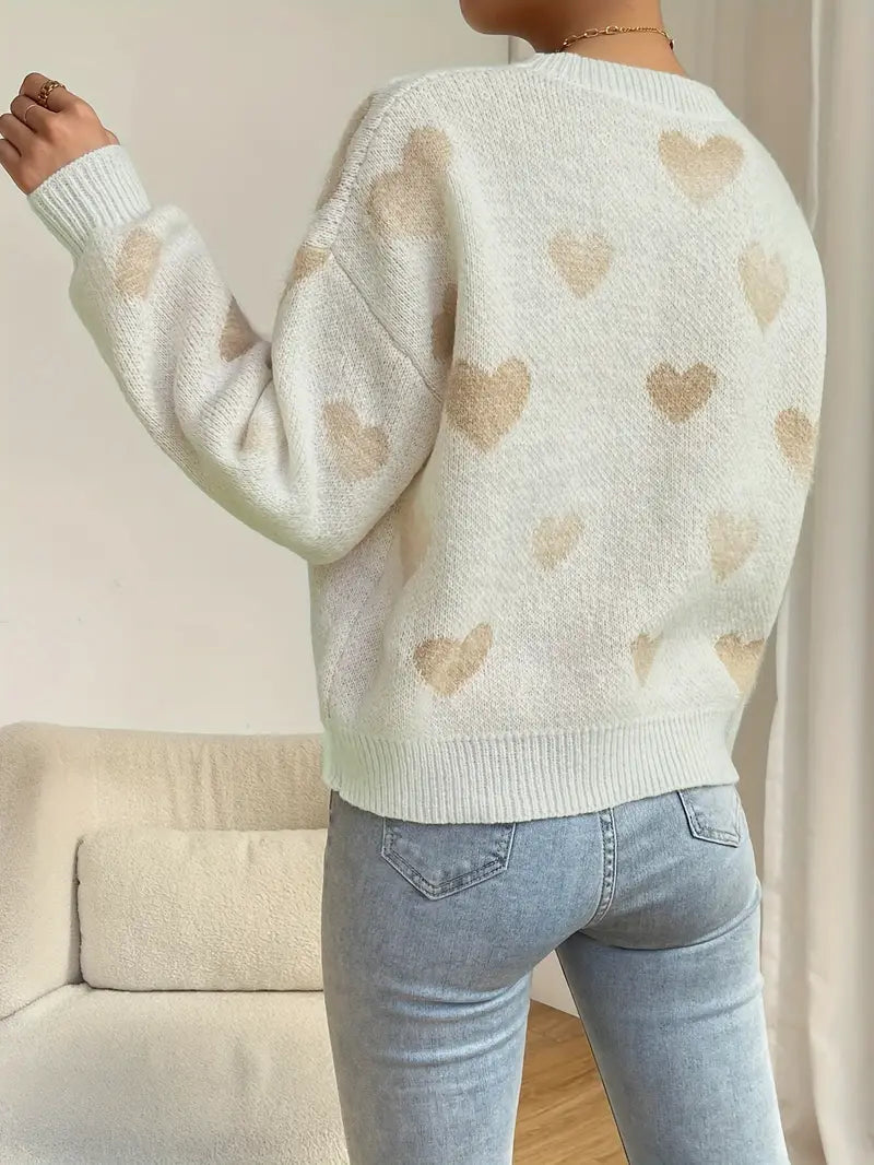 Zariah trui: charmante witte trui met zacht hartpatroon voor een speelse en knusse uitstraling. Perfect voor casual uitjes, knusse weekenden of ontspannen dagen thuis. Ontspannen pasvorm en zachte stof bieden comfort en warmte bij koelere temperaturen. Combineer moeiteloos met jeans, leggings of rokken voor veelzijdige looks. Verkrijgbaar in maten XS-L. Voeg een vleugje vrolijke charme toe aan je garderobe met de Zariah. Bestel nu en ervaar comfort en stijl in één!