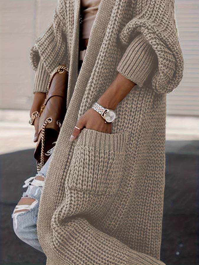 Vivienne | Voeg moeiteloze stijl en warmte toe aan je garderobe met de Vivienne. Deze oversized jas heeft een tijdloos silhouet, grote functionele zakken en is gemaakt van zachte, knusse stof. Verkrijgbaar in marineblauw, donkergrijs, kameel, lichtgrijs en zwart, en maten S-4XL. Perfect voor frisse dagen en stijlvolle casual looks. Combineer comfort en veelzijdigheid met de Vivienne. Bestel nu en geniet van tijdloze elegantie en ultiem draagcomfort!