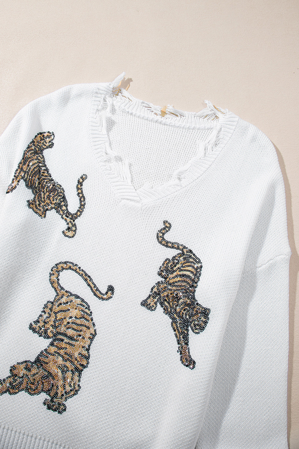 Monroe | Witte trui met rafelige details en pailletten