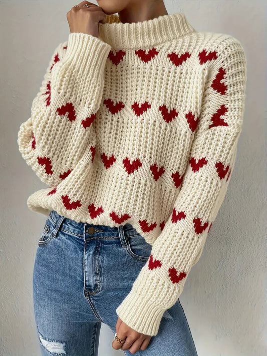 Naomi trui met hartpatroon – een warme en speelse essential voor de gezellige seizoenen. Met een textured breisel, knusse turtleneck en relaxte pasvorm biedt deze trui comfort en stijl. Perfect voor casual dagen, gezellige avonden of als speelse toevoeging aan je garderobe. Combineer moeiteloos met jeans, leggings of rokken. Verkrijgbaar in beige, maten S-L. Voeg charme en warmte toe aan je outfit met de Naomi. Bestel nu!