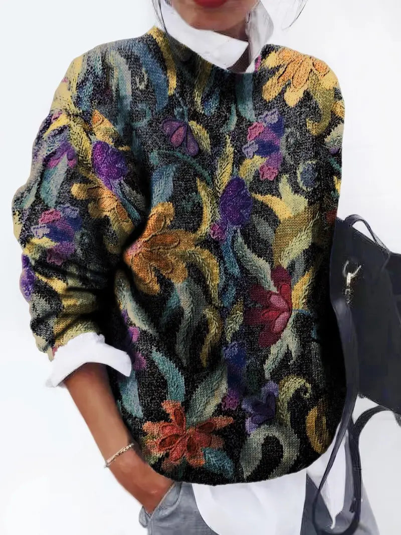 Quinta trui: artistieke elegantie en vintage charme. Met een gobelin-geïnspireerd bloemenmotief voegt het verfijning en textuur toe aan je casual garderobe. Ideaal voor koelere dagen, casual uitjes of geklede gelegenheden. Zachte pasvorm en veelzijdig te combineren met jeans, broeken of rokken. Verkrijgbaar in zwart, maten S-2XL. Voeg een vleugje kunstzinnige charme toe aan je stijl met Quinta. Bestel nu en geniet van tijdloze elegantie en comfort!