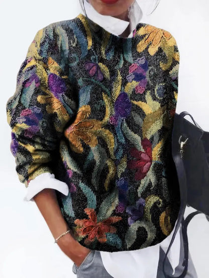Quinta trui: artistieke elegantie en vintage charme. Met een gobelin-geïnspireerd bloemenmotief voegt het verfijning en textuur toe aan je casual garderobe. Ideaal voor koelere dagen, casual uitjes of geklede gelegenheden. Zachte pasvorm en veelzijdig te combineren met jeans, broeken of rokken. Verkrijgbaar in zwart, maten S-2XL. Voeg een vleugje kunstzinnige charme toe aan je stijl met Quinta. Bestel nu en geniet van tijdloze elegantie en comfort!