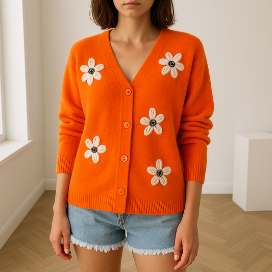 Mirte cardigan met bloemenprint biedt stijl, comfort en veelzijdigheid. Gemaakt van zachte polyester stof, perfect voor koelere dagen en eenvoudig te combineren met tops, blouses en jurken. Verkrijgbaar in groen, grijs, oranje en rood in maten XS t/m 2XL. De V-hals en lange mouwen zorgen voor een flatterende pasvorm en een vrouwelijke uitstraling. Ideaal voor werk, casual dagen of een avondje uit. Voeg Mirte toe aan je garderobe en straal moeiteloos bij elke gelegenheid!