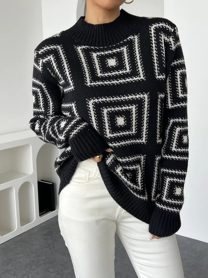 Winona geometrisch gebreide trui: moderne stijl en artistieke flair met contrasterende patronen in zwart. Perfect voor casual uitjes, knusse momenten thuis of stijlvolle gelegenheden. Gestructureerde pasvorm en zachte stof voor comfort en warmte op koelere dagen. Combineert moeiteloos met jeans, rokken of nette broeken. Eén maat past bij verschillende looks. Voeg moderne elegantie en eigentijdse flair toe aan je garderobe met de Winona. Bestel nu en maak een statement!