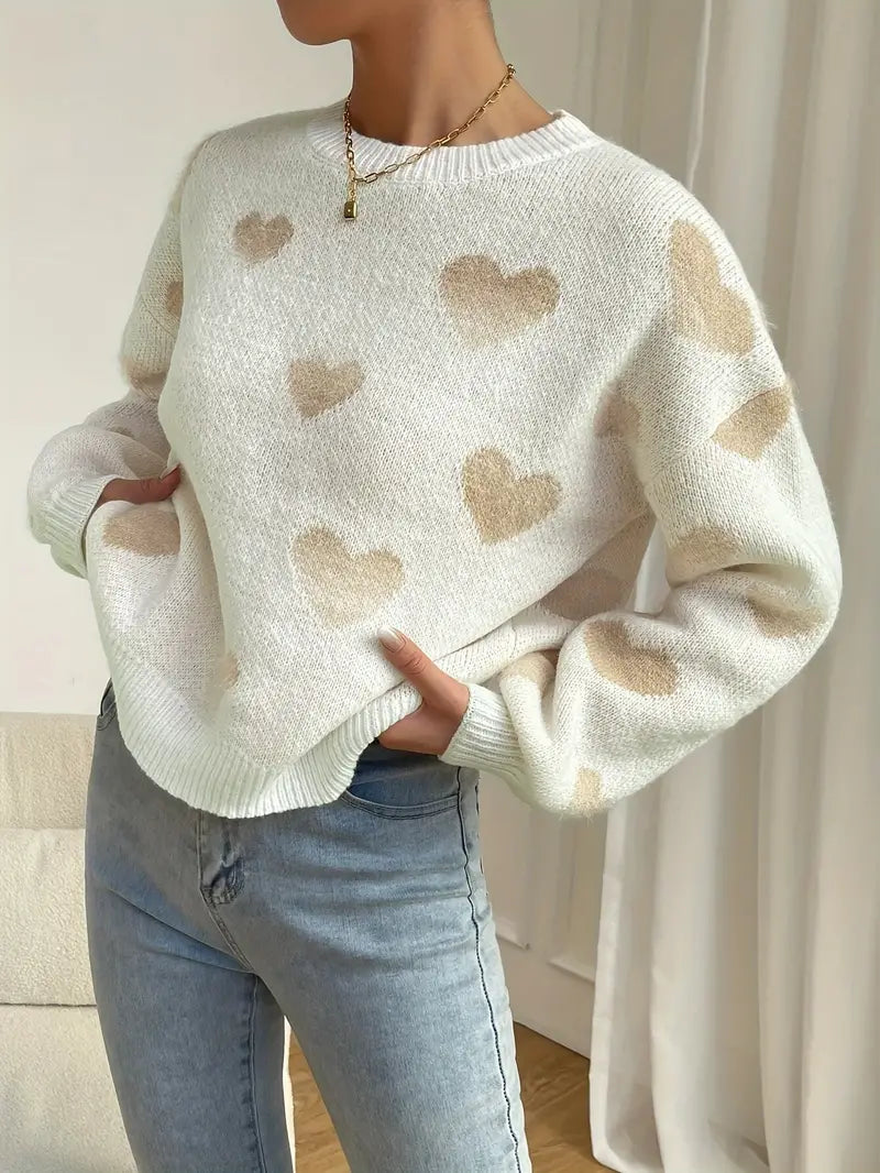 Zariah trui: charmante witte trui met zacht hartpatroon voor een speelse en knusse uitstraling. Perfect voor casual uitjes, knusse weekenden of ontspannen dagen thuis. Ontspannen pasvorm en zachte stof bieden comfort en warmte bij koelere temperaturen. Combineer moeiteloos met jeans, leggings of rokken voor veelzijdige looks. Verkrijgbaar in maten XS-L. Voeg een vleugje vrolijke charme toe aan je garderobe met de Zariah. Bestel nu en ervaar comfort en stijl in één!